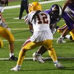 Viking Morgan Paul lowers his shoulder against Kingstons Deondre Pierce.