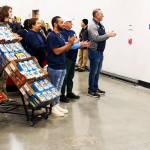Employees greet the first customers just after 8 a.m.