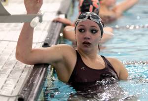 Elisha Meyer/Kitsap News Group Photos
Senior Kelsey Robertson rests after competing in the 500-yard freestyle at South Kitsaps first and only home meet of the year at the finally finished pool.