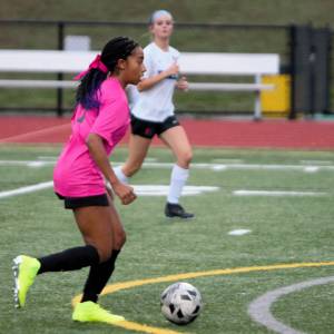 Elisha Meyer/Kitsap News Group
Amira Lyons takes a deflected ball down the field, leading to another first-half Klahowya goal.