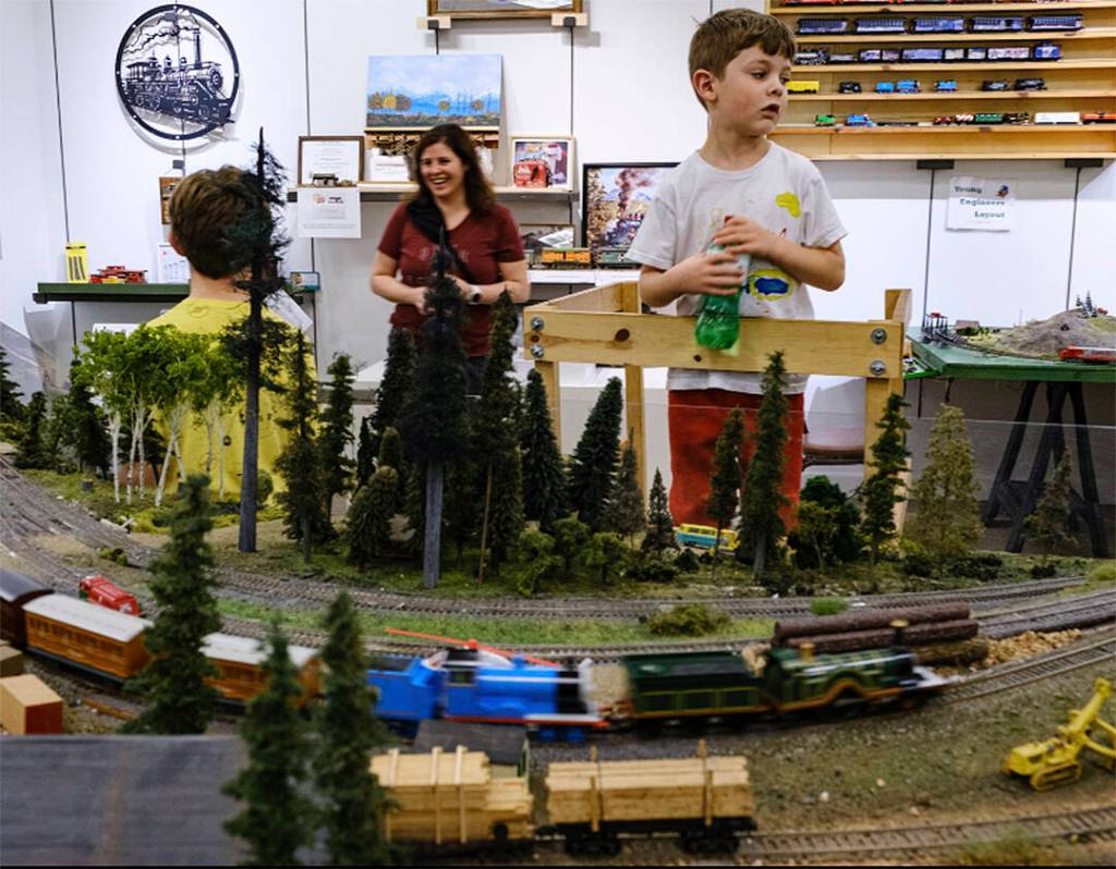 A family enjoys checking out the trains on display at the Kitsap Mall.