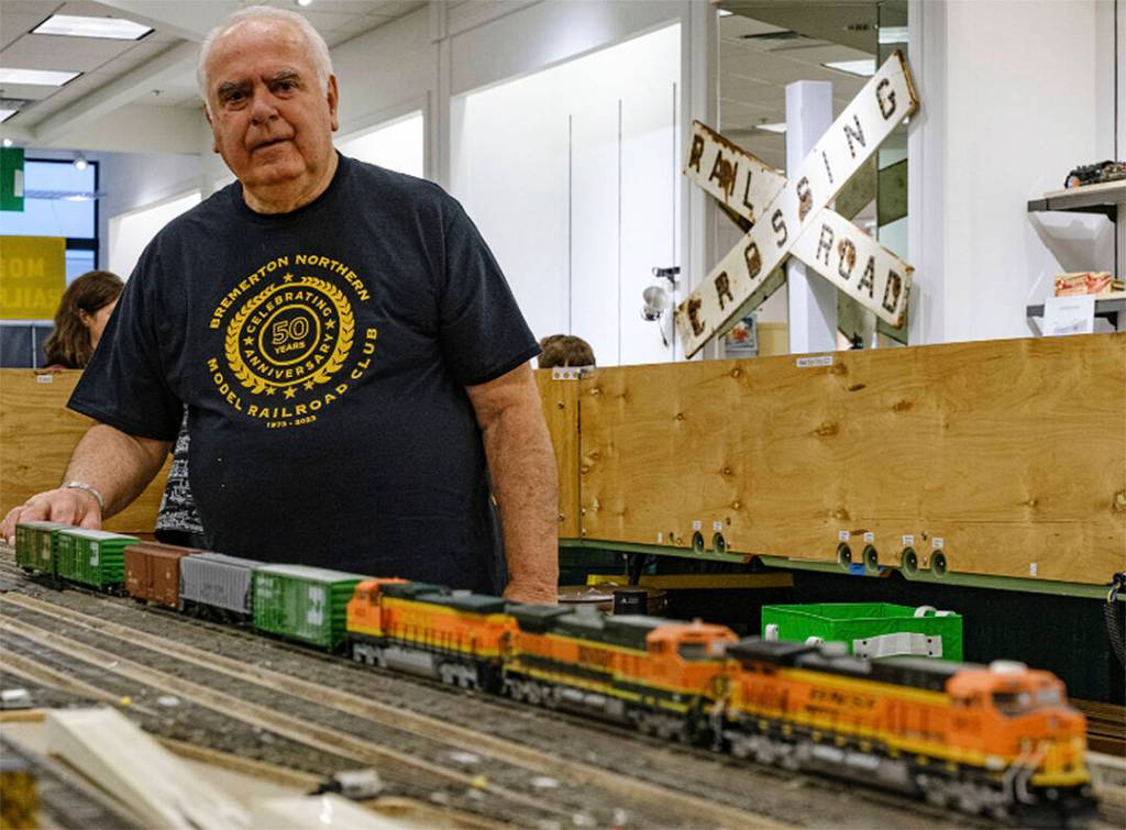 Frank Ralph marshals a set of locomotives and cars prior to running them on the HO line.