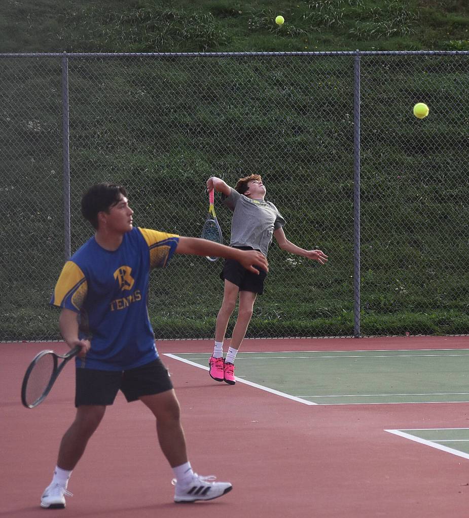 Knight Troyer Kealoha and Viking Grady DeVries begin the league tournament with their serves.