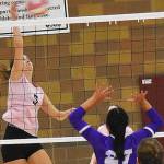 Corynn Heuer of Kingston tips the ball over the net.