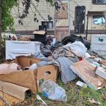 Elisha Meyer/Kitsap News Group Photos
Litter piles up next to a broken trailer in the Bravo Terrace encampment.