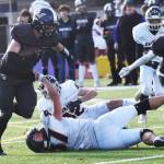 Nicholas Zeller-Singh/Kitsap News Group Photos
Lelond Anderson of NK jukes a pair of defenders for the first down.