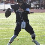 Viking quarterback Cole Edwards throws for one of his five touchdowns.