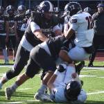 EJ Vailolo of NK drives the Ephrata quarterback into the ground.