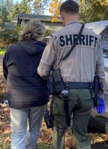 KCSO courtesy photos
The woman suspected of multiple residential burglaries and post office break-ins is brought into custody.