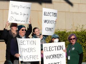 Elisha Meyer/Kitsap News Group
Jeff Wiley (back left) and Elizabeth Doll (back right) stands among the Kitsap residents standing up for election workers in the county.
