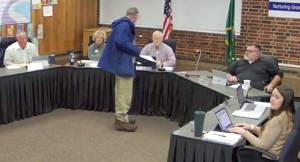 SKSD courtesy photo
Footage from the Nov. 14 South Kitsap School District meeting shows Director Jeff Daily (standing) approach Director John Berg in the midst of a tirade against the district and board members.