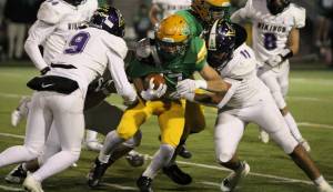 Elisha Meyer/Kitsap News Group
Seniors Kaden Pickard and Ben Gomez team up to bring down a Thunderbird runner.