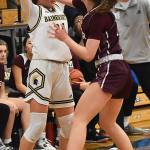 Islanders' Caitlin Monahan pokes the ball from Spartan Bella Ramirez.