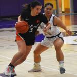 Nicholas Zeller-Singh/Kitsap News Group Photos
Cougar Chelsey Cobb dribbles past Viking Tiffany Le.