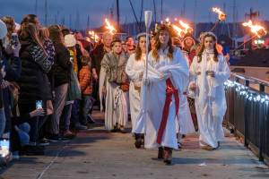 Damon Williams/Kitsap News Group Photos
The Lucia Brides procession during Julefest in downtown Poulsbo Dec. 2.
