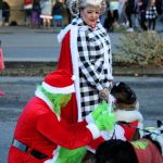 Chase Austin (lower left) and Stephanie Gay (center) show theyve got plenty of holiday style in their parade-winning costumes.