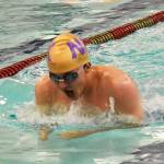 Viking Levi McClain leads the relay teams to first-place finishes.