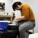 Jacob Cowan goes to work at the wheel, demonstrating his many years of experience in ceramics.