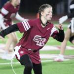 Senior Emily Bennett backs up to cover a receiver on a defensive play for the Wolves.