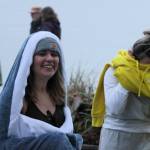 Kylee Davis, left, hangs out in her warm shark towel minutes before taking the plunge in Seabeck.