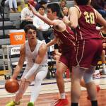 Nicholas Zeller-Singh/Kitsap News Group Photos
NK guard Cade Orness, who led the team with 31 points, drives inside against the Buc bigs.