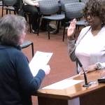 Pam Crowe is sworn into council by Mayor Becky Erickson.
