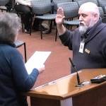 Rick Eckert is sworn into council by Mayor Becky Erickson.