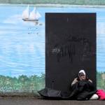 Elisha Meyer/Kitsap News Group Photos
A homeless man sits against the wall of the Kitsap Rescue Mission building on 6th Street.