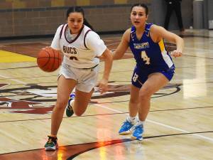 Nicholas Zeller-Singh/Kitsap News Group Photos
Buc Khi Tall Bull drives past Knight Attiana Cabatto.