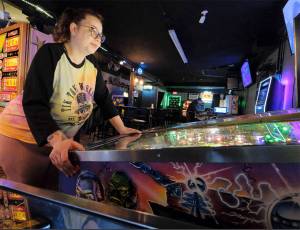 Damon Williams/Kitsap News Group Photos
Jessica Barron plays a pinball machine at a recent tournament in Bremerton.