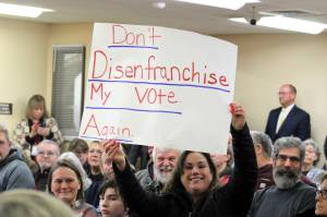 Elisha Meyer/Kitsap News Group
Several signs were brought into the packed Kitsap County courtroom Jan. 16.