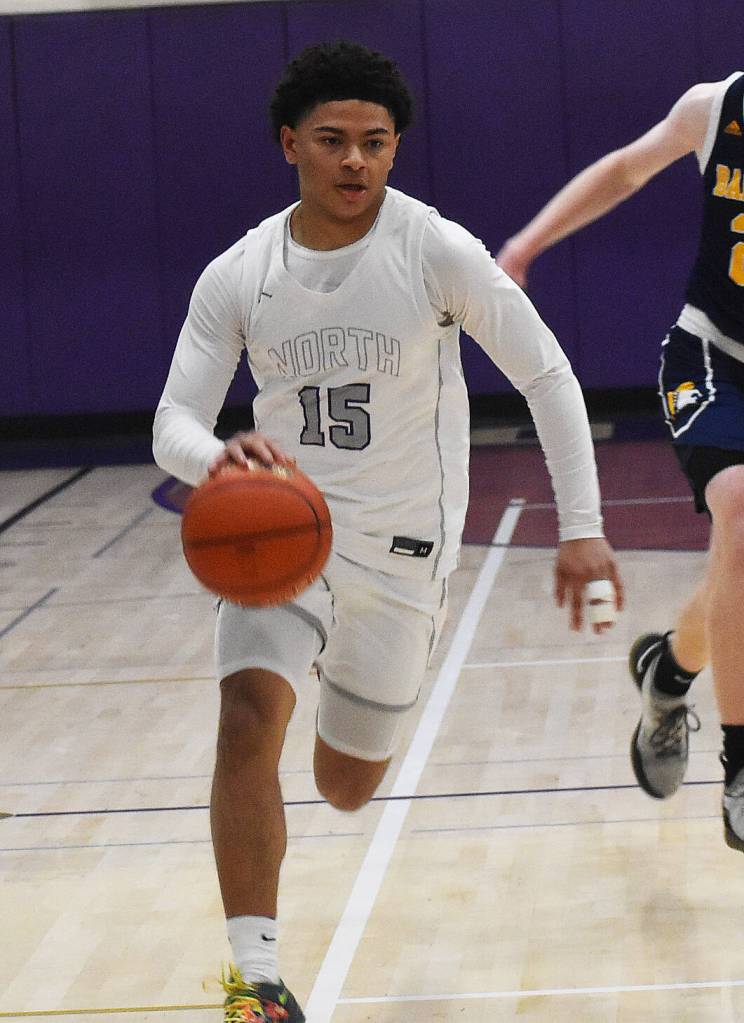 NKs Jordan Williams dribbles down the court in transition.