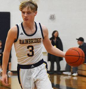 Nicholas Zeller-Singh/Kitsap News Group Photos
Spartan Sam Nylund drives toward the hoop.