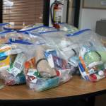 Bags and bags of hygiene products are made up and ready for distribution.