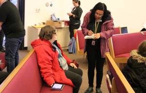 Elisha Meyer/Kitsap News Group Photos
Susan Schultheis sits while being checked in for her COVID shot.