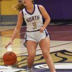 Viking Andrea Zetty dribbles the ball in transition.