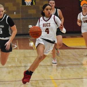 Nicholas Zeller-Singh/Kitsap News Group Photos
Harmony Tyson scores the first three baskets for Kingston.