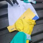 A gardening glove and a yellow rag wrapped in a piece of paper with political advertising adjacent to the Sons of Norway parking lot on Jan. 26.