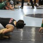 The referee keeps a close eye on an eventual win for junior Hayden Sternod.