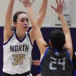 Nicholas Zeller-Singh/Kitsap News Group Photos
Vikinng Avery Kline reaches over Trojan Sophia Brown for the ball.