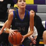 Trojan Sophia Brown looks to score a layup.