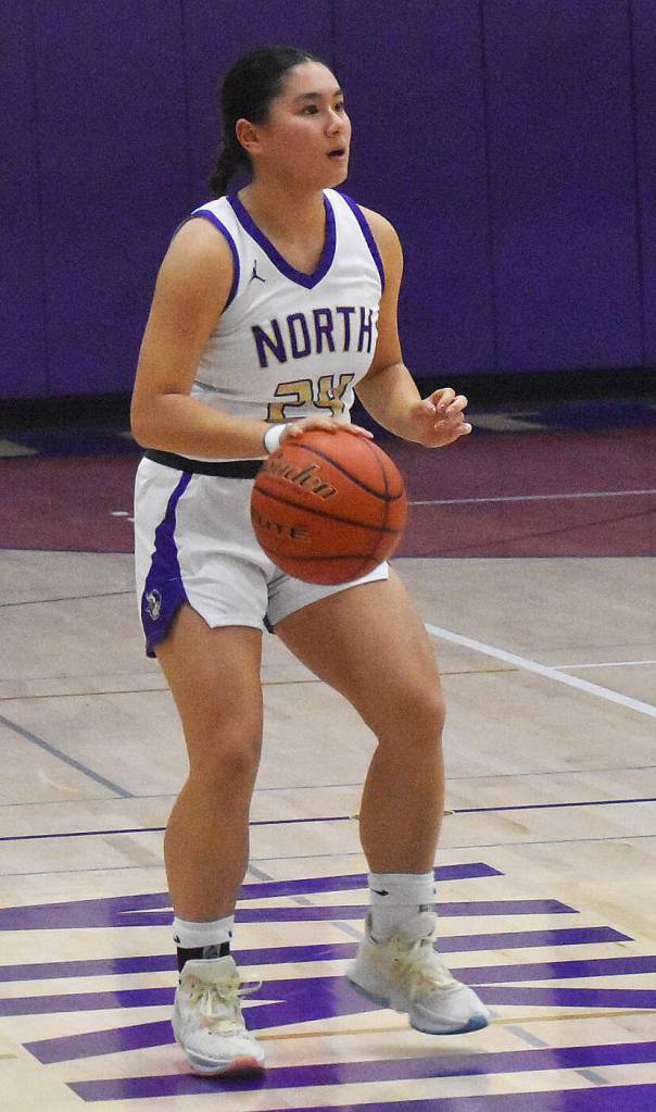 Viking Tiffany Le takes the ball down the court.