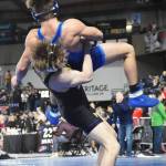 NKs Jaxon Johnson slams his opponent for the takedown.