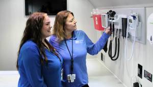 Elisha Meyer/Kitsap News Group
PCHS CEO Dr. Jennifer Kreidler-Moss (center) shows off the features of the new mobile healthcare van.