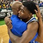 Amber Plummer courtesy photo
Bremerton coach Miah Davis celebrates with his players after advancing to the semifinals.