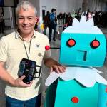 Port Orchard tech wiz Robert Zollna with his homemade replica of Rosie the Robot, made popular in the The Jetsons cartoon.