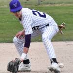 Viking Spencer Gillespie fields the ground ball at third base.