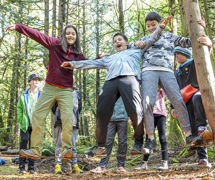 Jennifer Ansley, IslandWood courtesy photos
Kids balance on a slackline during an overnight school trip to IslandWood last fall.