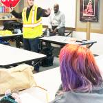 Mike De Felice/Kitsap News Group
Discovery High School senior Jakob Pringle demonstrates his flagging technique to the class.
