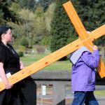 The cross is carried across Mitchell Road over Lund Avenue.